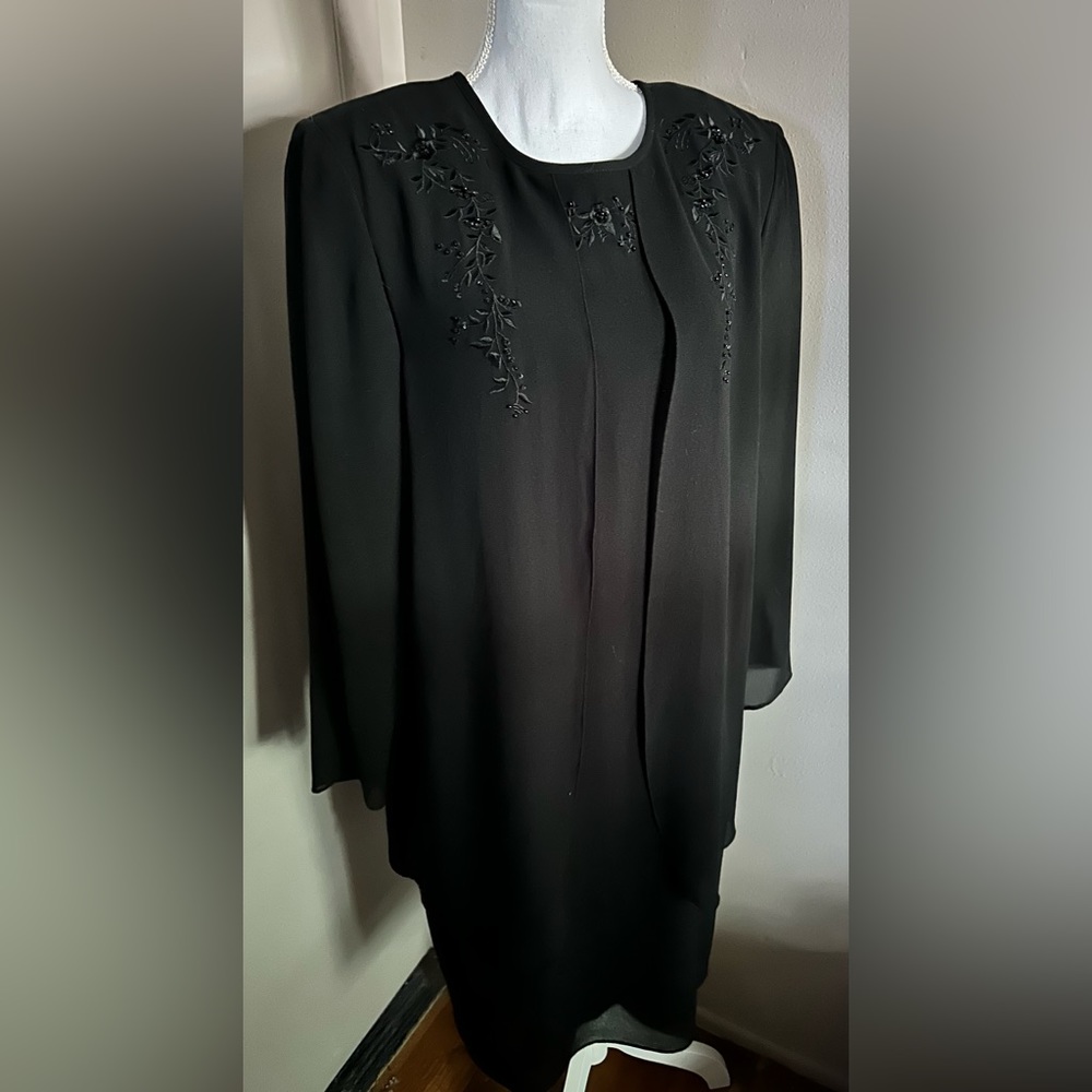 Black long sleeve dress, with lapel accents. Size 14